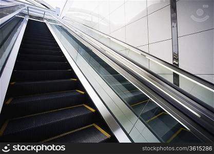 Japan, Osaka, JR Station, man on top of escalator