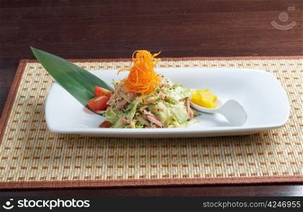 Japan salad with smoked chicken and vegetables closeup