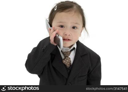 Japanese American 2 year old girl in suit with cellphone.