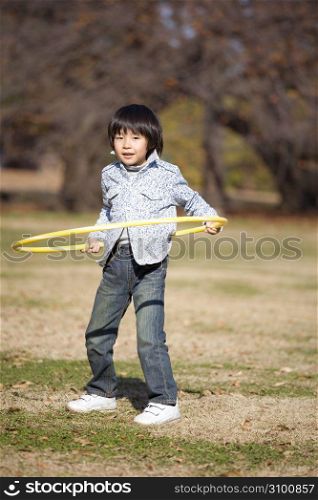 Japanese boy playing in the park