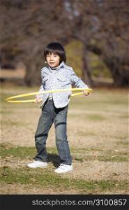 Japanese boy playing in the park