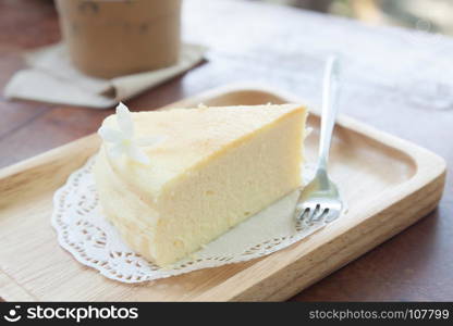 Japanese cheese cake on wooden plate