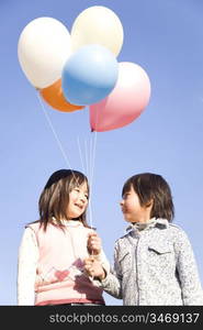 Japanese children having balloons