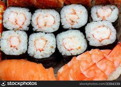 Japanese cuisine background - set of rolls and sushi