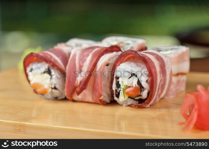 Japanese cuisine - sushi roll with bacon