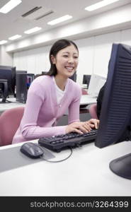 Japanese female student operating a PC