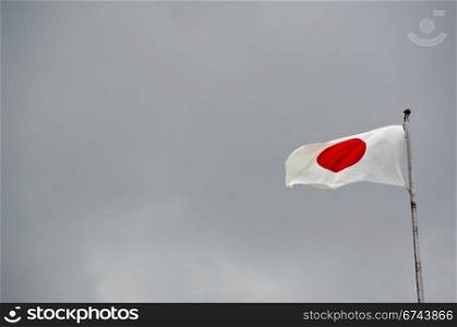 Japanese flag. Japanese flag on flag pole in wind