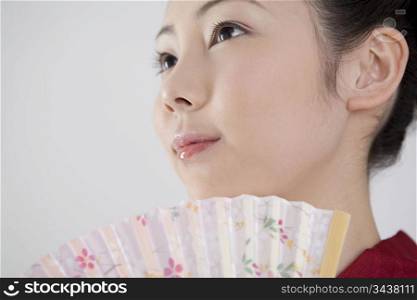 Japanese folding fan and yukata woman
