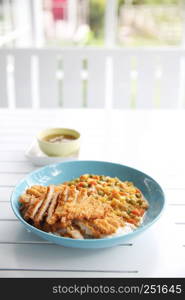 Japanese food Curry rice with fried pork on wood background