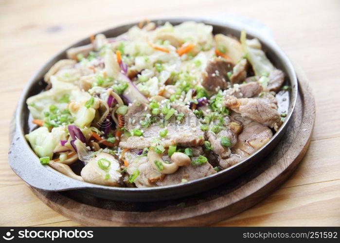 Japanese food pork with ginger on pan in wood background