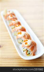 Japanese food Salmon roll on wood background