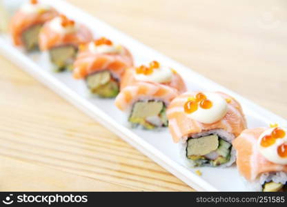 Japanese food Salmon roll on wood background