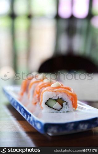 Japanese food Salmon roll on wood background