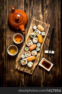 Japanese food . The sushi rolls and herbal tea.. The sushi rolls and herbal tea.