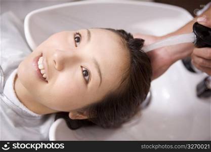 Japanese girl has a shampoo