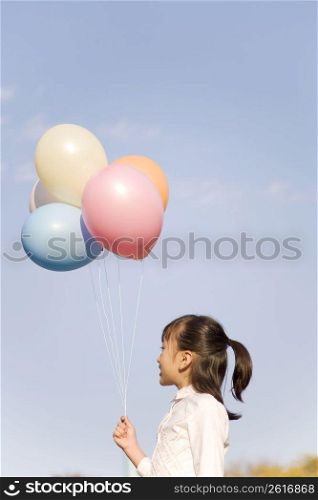 Japanese girl having balloons