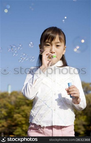 Japanese girl playing with bubble