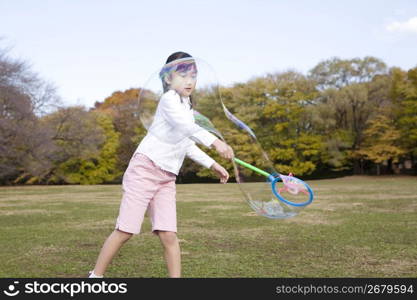 Japanese girl playing with bubble