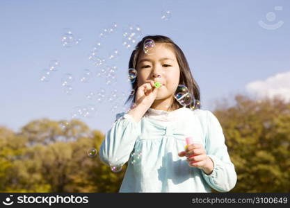 Japanese girl playing with bubble