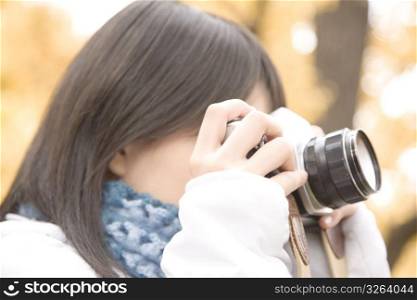 Japanese girl shooting a photo
