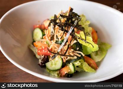 Japanese green mix salad in white bowl