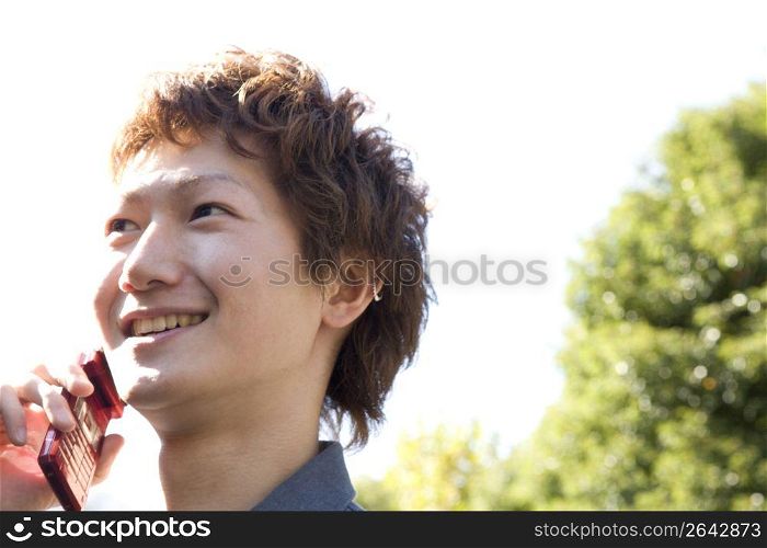 Japanese man talking with cellphone