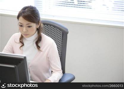 Japanese office lady gazing a monitor