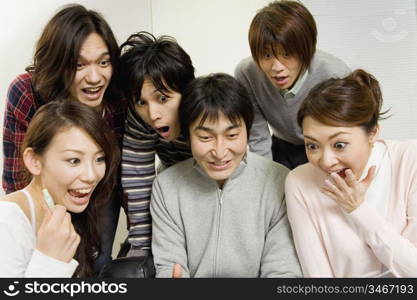 Japanese office workers having brief meeting