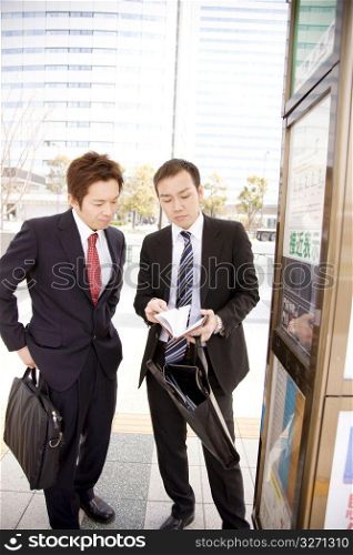 Japanese office workers waiting for the bus