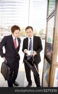Japanese office workers waiting for the bus