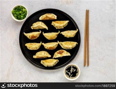 Japanese pan-fried dumplings, Gyoza, are popular weeknight meal as well as a great appetizer for dinner party. Vegetarian potstickers recipe.
