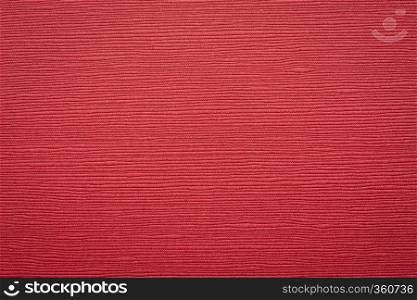 Japanese red linen washi paper with an embossed linear groove texture