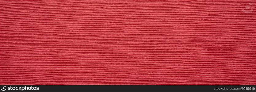 Japanese red linen washi paper with an embossed linear groove texture, panoramic banner