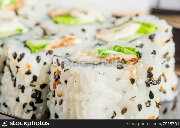 Japanese rolls with sesame seeds close-up shot