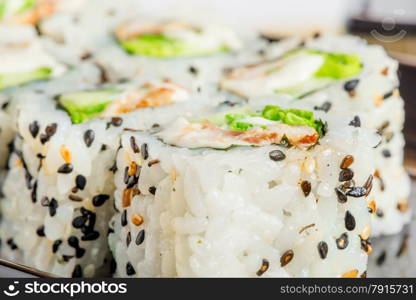 Japanese rolls with sesame seeds close-up shot