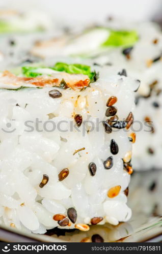 Japanese rolls with sesame seeds close up vertical picture