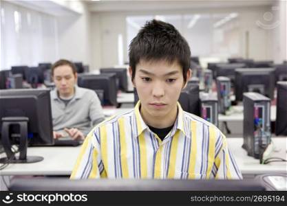 Japanese student operating a PC