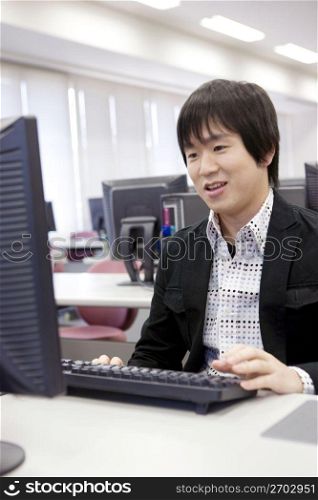Japanese student operating a PC