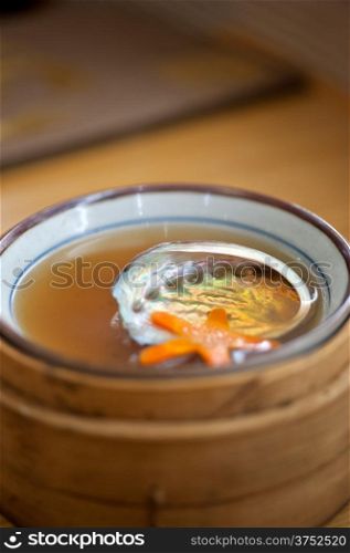 Japanese style abalone soup empty shell on bamboo bowl set holder