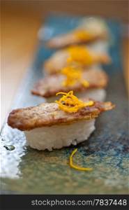 Japanese style sushi fried goose liver macro closeup