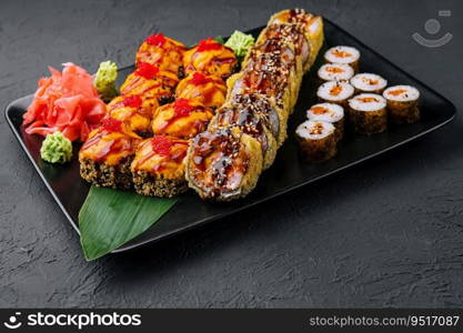 Japanese sushi assorted on a black stone plate