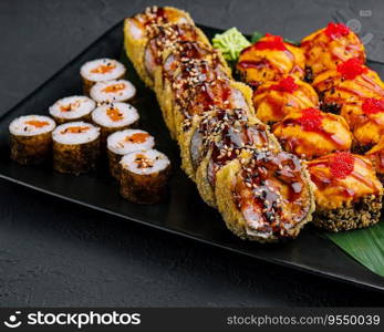 Japanese sushi assorted on a black stone plate