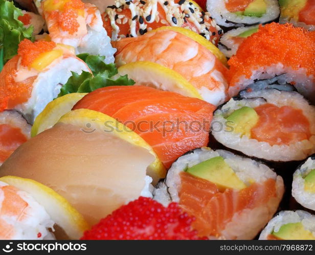Japanese sushi close up with a variety of delicious prepared fresh raw fish and seafood as salmon shrimp and caviar with rice and vegetables as a food and drink concept of Asian cuisine and catering for a healthy Lifestyle.