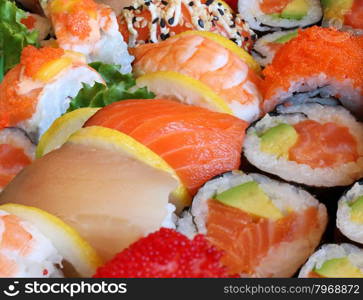 Japanese sushi close up with a variety of delicious prepared fresh raw fish and seafood as salmon shrimp and caviar with rice and vegetables as a food and drink concept of Asian cuisine and catering for a healthy Lifestyle.