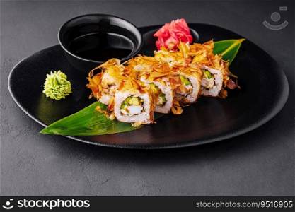 japanese sushi rolls on a black plate