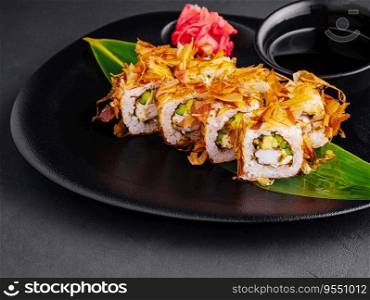 japanese sushi rolls on a black plate