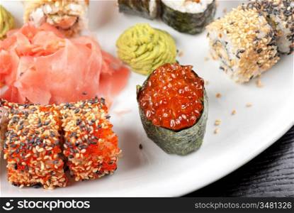 japanese sushi set with red caviar sushi in the foreground