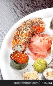japanese sushi set with red caviar sushi in the foreground
