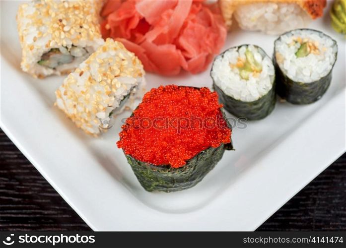 japanese sushi set with red tobiko sushi in the foreground