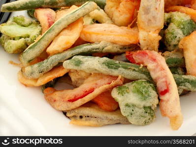 Japanese tempura with fresh vegetables fried in a light batter.